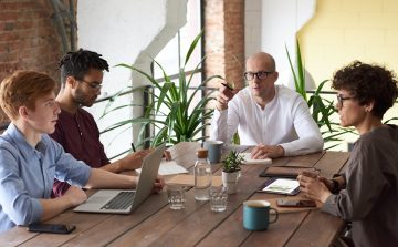 employees and contractors around table