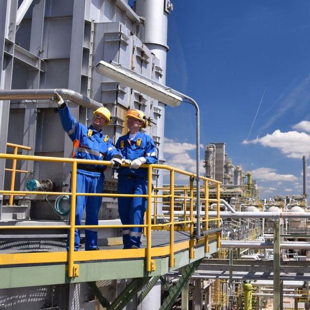 oil refinery workers on platform